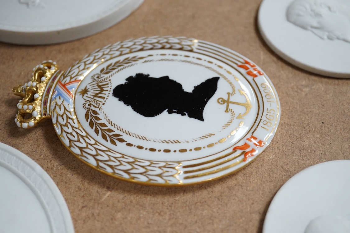 A pair of Copenhagen biscuit porcelain circular plaques, of Night and Day, two smaller French portrait plaques of Emperor Napoleon III and Empress Eugenie , and a Royal Copenhagen Princess Marie commemorative plaque, c.1